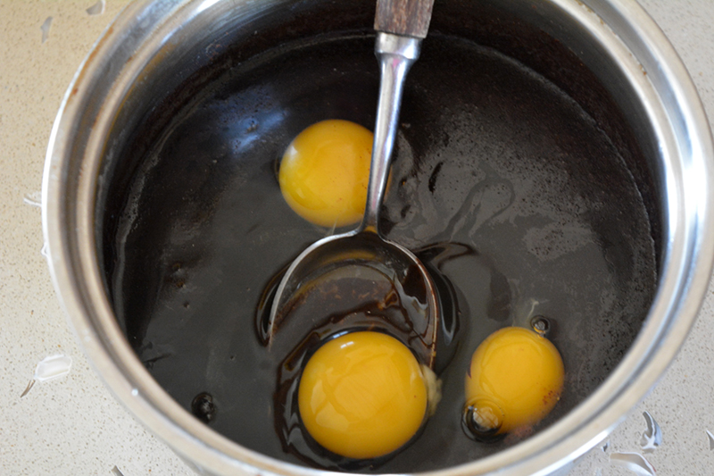 Stir in the eggs and sugar. If the mixture is too hot, the eggs will curdle, but don't worry too much, just mix vigorously.